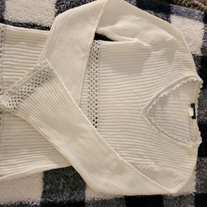 White sweater with silver trim